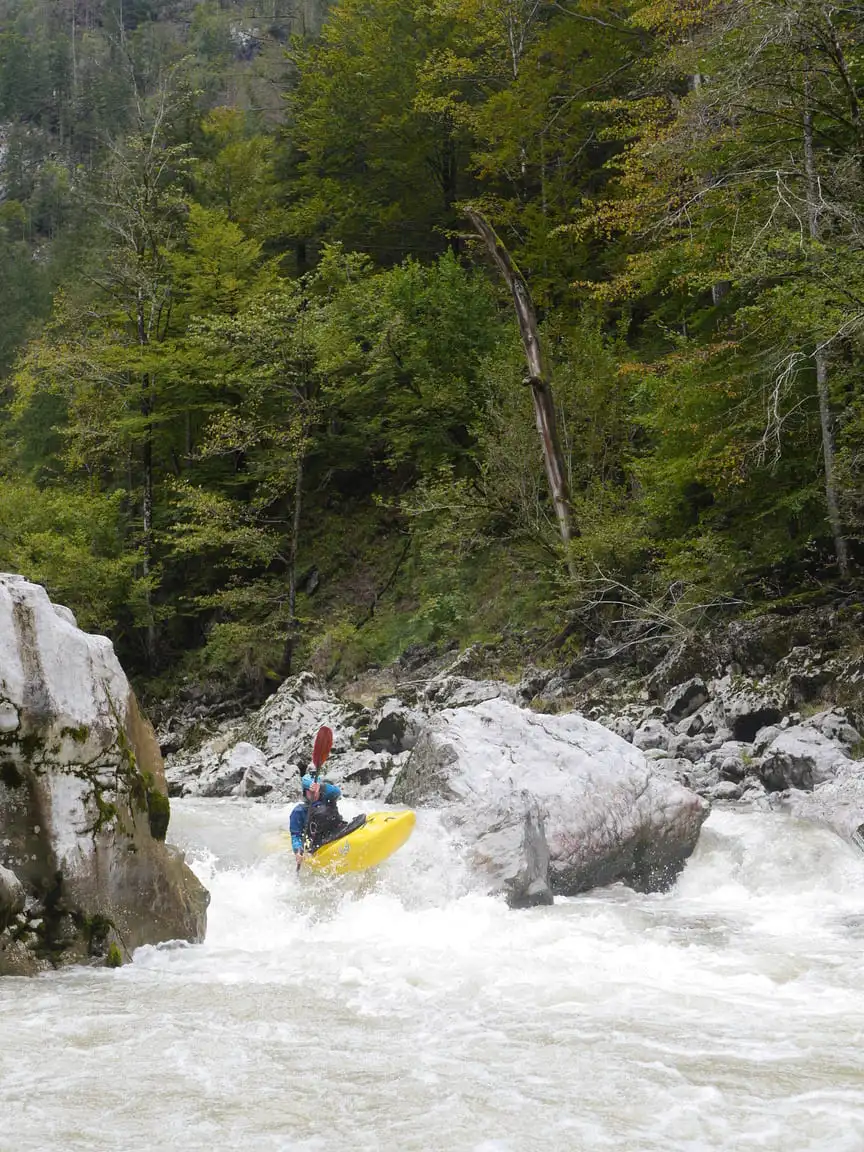 A kayaker going down the Enns river in Gesäuse Nationalpark.